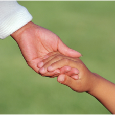 Child grabbing parent's hand